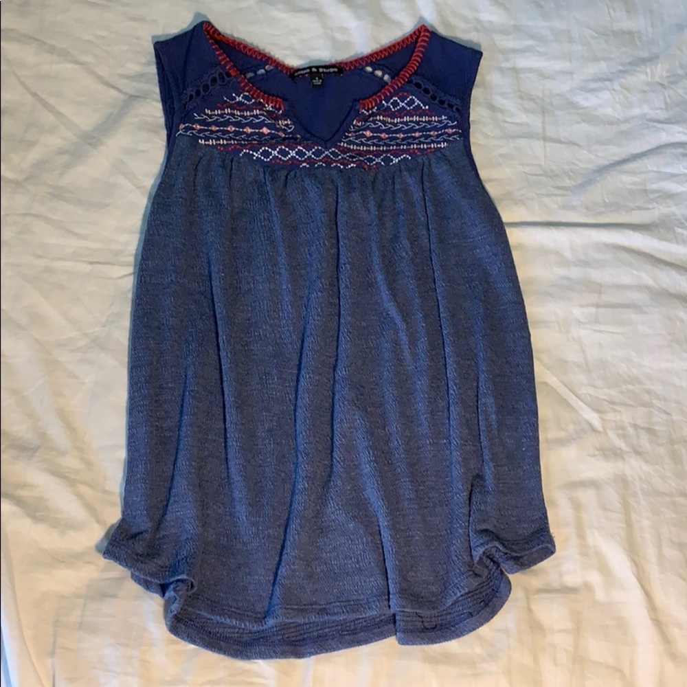 Sleeveless Cable and gauge top.